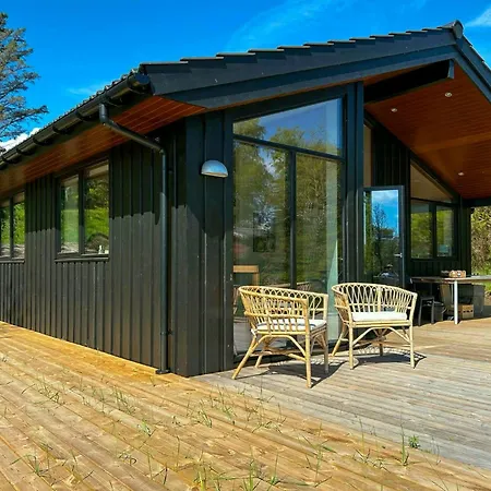 Hébergement de vacances Moderne Traehus I Helgenaes' Bakkede *